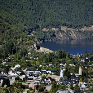 Beautiful aerial view of San Martin de los Andes surrounded by lush forests and mountains.
