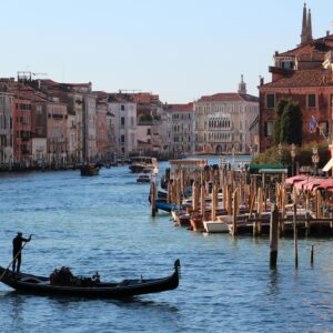 Experience a classic gondola ride on Venice's iconic Grand Canal, revealing stunning architecture and vibrant waterways.