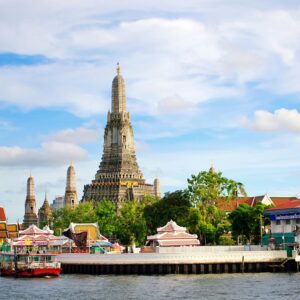 Beautiful view of Wat Arun Temple across the Chao Phraya River in Bangkok, Thailand.