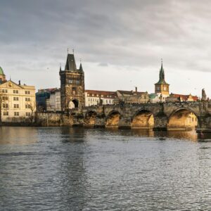 Historic Charles Bridge in Prague with iconic architecture and river view.